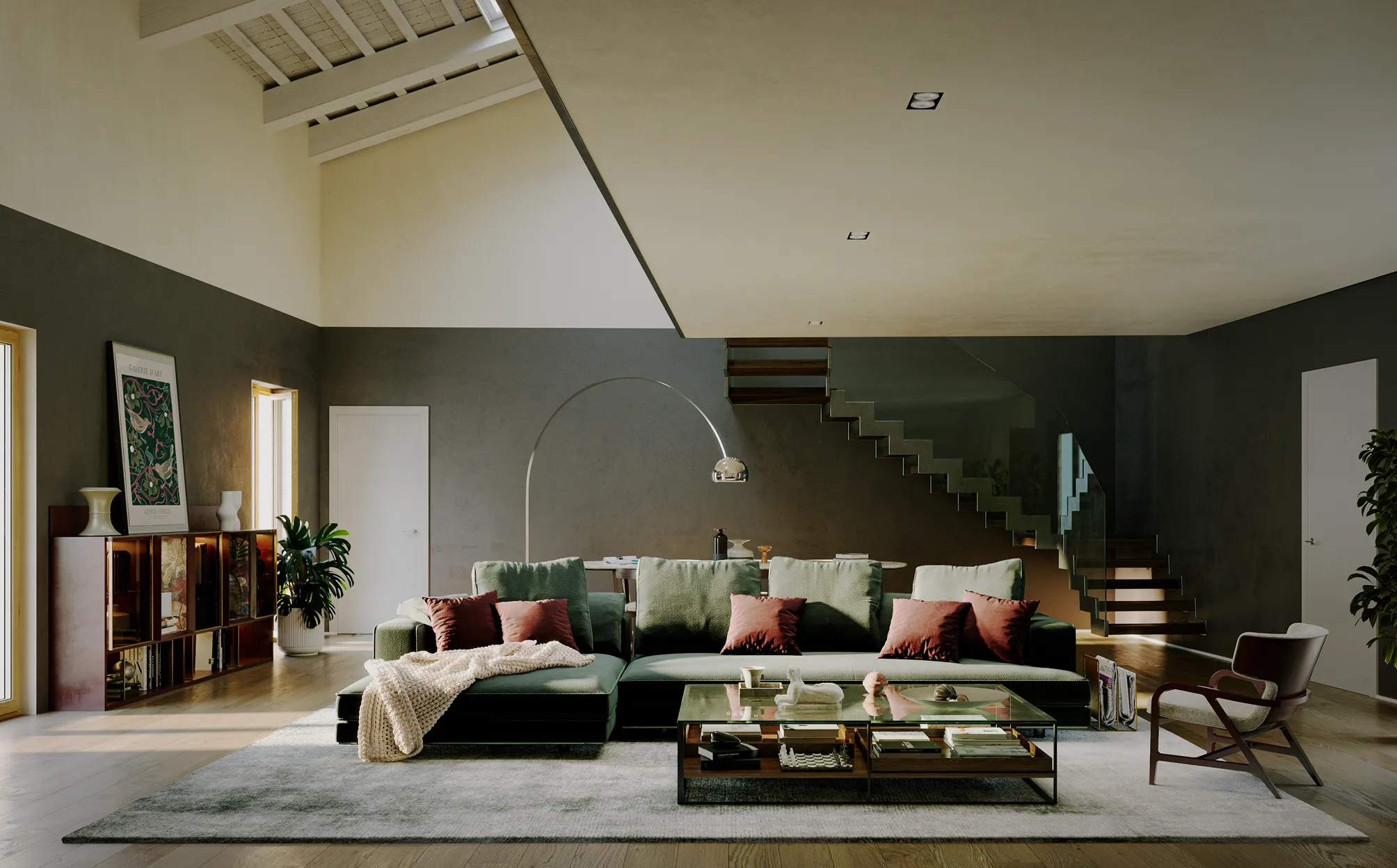 Soggiorno moderno con divano verde scuro a L con cuscini rossi, tavolino in vetro, poltrona marrone e lampada ad arco in un ambiente luminoso con pareti grigie e scala in vetro.